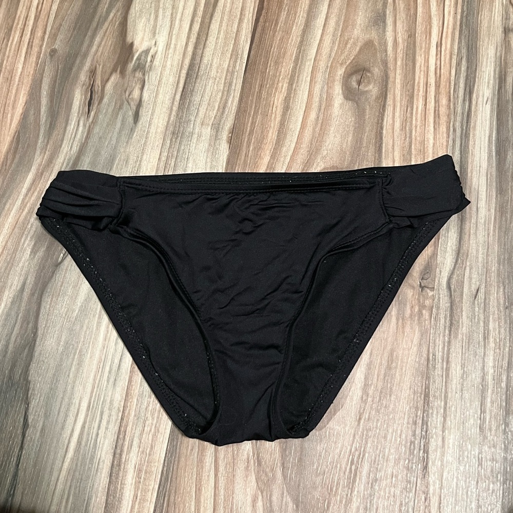 Black bikini bottoms size small with ruffle on hips